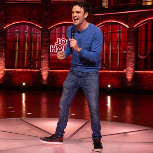 Recovery Comedian Josh Harris performing stand up comedy on TV.